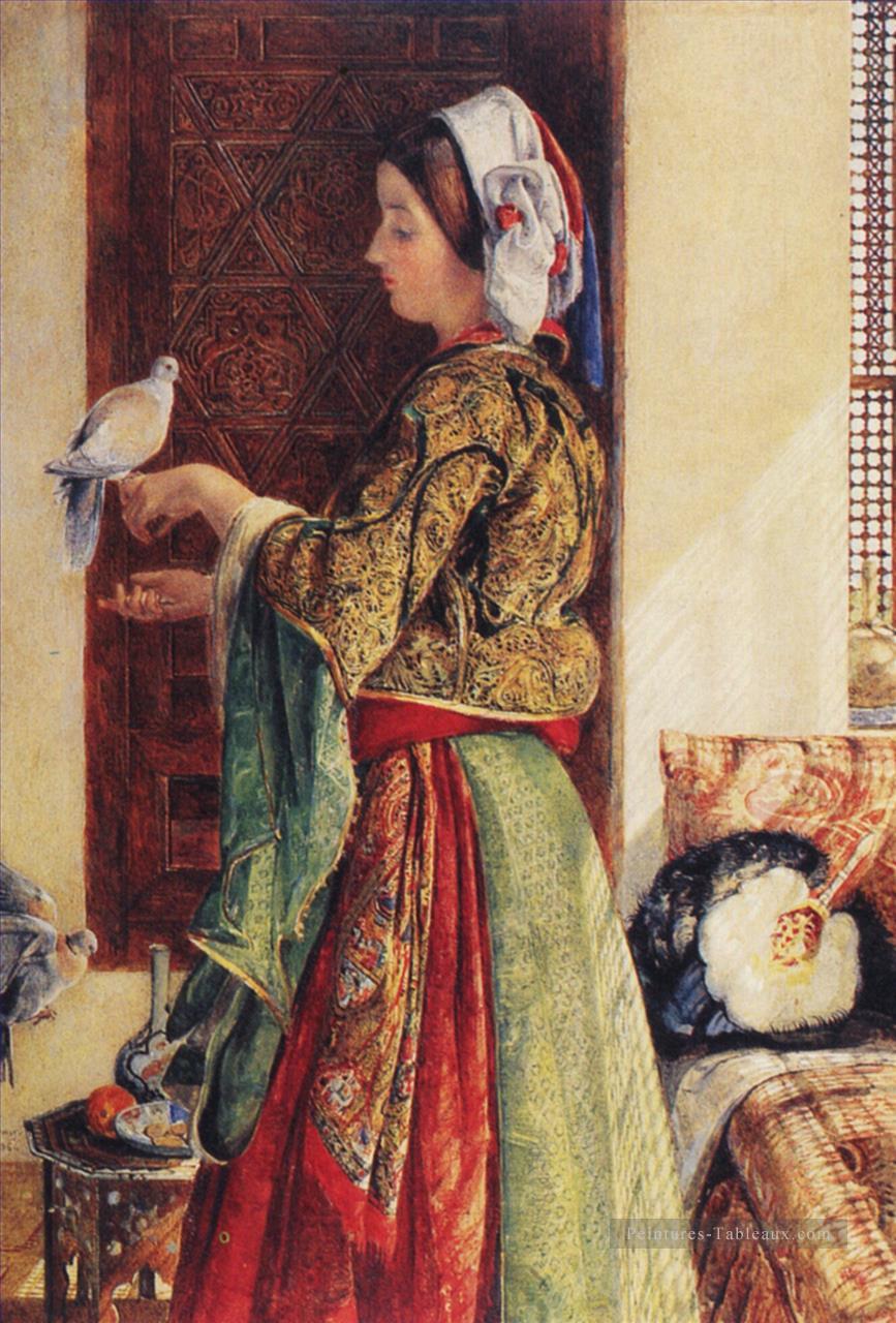 Fille avec deux colombes en cage Oriental John Frederick Lewis Peintures à l'huile